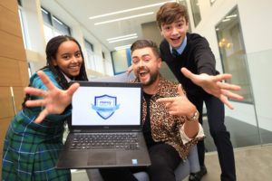 Bank of Ireland Youth Ambassador James Patrice is pictured at the launch of the Bank of Ireland Money Smarts Challenge, with students Katie Farmer (15) from Castleknock and Colin Eiffe (13) from Rathcoffey.