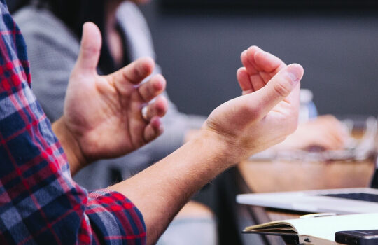 Hands in a discussing position