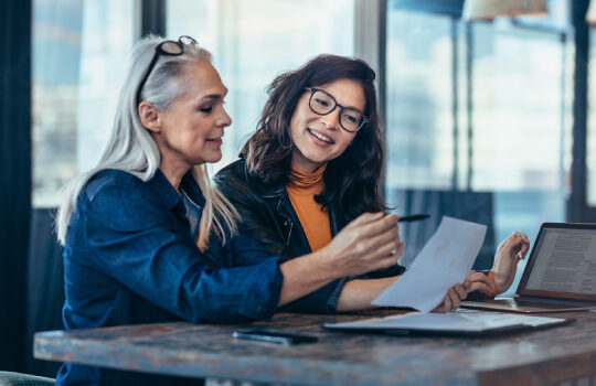 tow women doing paperwork